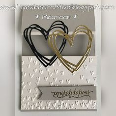 two hearts are placed on top of each other in a card that says congratulationss