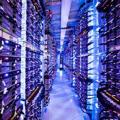 the inside of a server room filled with lots of wires and computers in rows on shelves