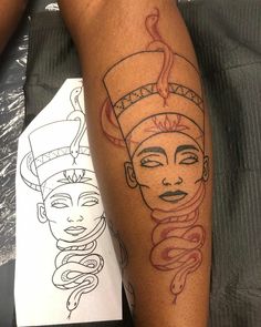 a woman's leg with a tattoo on it that has a drawing of an egyptian queen