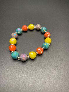 Multi colored beaded bracelet Multicolor Beaded Round Crystal Bracelet, Casual Beaded Bracelets With Round Beads, Multicolor Beaded Crystal Bracelet, Rainbow Crystal Bracelet With Colorful Round Beads, Trendy Multicolor Stretch Bracelet With Round Beads, Casual Beaded Bracelets For Jewelry Making, Multicolor Round Casual Jewelry, Casual Multicolor Round Jewelry, Colorful Faceted Beads Bracelets As Gift