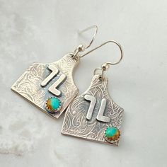 Discover the perfect accessory for the cowgirl bride with our Sterling Silver Initial Cow Tag Earrings, a unique blend of personalized elegance and rodeo charm. These custom letter earrings make an unforgettable gift, embodying the spirit of the rodeo with a chic, personalized touch. Personalize with your initial or brand placement will depend on brand or initials. You can add 2 initials to this for best fit and look. ◈ FEATURES ◈ ☙ Personalized cow tag earrings☙ Crafted from solid sterling silv Cow Tag Earrings, Cowgirl Bride, Cow Tag, Cattle Brands, Bracelet Size Chart, Letter Earrings, Sterling Silver Initial, Custom Letters, Kingman Turquoise