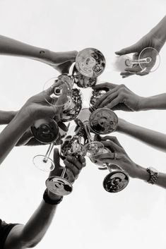 a group of people holding wine glasses together