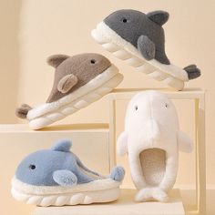 Snuggle up in style with these adorable shark-shaped plush slippers. The fluffy fabric and soft fill make them perfect for lounging around the house or binge watching your favorite show. Available in four playful colors, these slippers also make a great gift for any animal lover. Treat your feet to ultimate comfort and a touch of fun with these fluffy slippers. Available in 5 sizes and 4 colors. Upper material: Plush Sole material: Soft PVC Sizing: Women * If you are unsure about which size is f Cartoon Whale, Whale Plush, Shark Slippers, Shark Plush, Whale Design, Plush Slippers, Bedroom Slippers, Cute Shark, Cute Flats