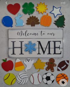 a sign that says welcome to our home surrounded by various sports and pumpkins on it