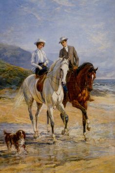 two people riding horses on the beach with a dog