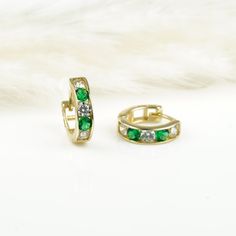 10K Gold Emerald Hoop Earrings 9.5 mm are handcrafted in 10K Solid Gold and high-quality white and green Cubic Zirconia. These minimalist, stylish, and dainty hoop earrings are ever-trendy and don't go out of fashion. They are perfect gifts for her and him.  Weight: 0.9 gr Outer diameter: 9.5 mm Width: 2.7 mm Gemstone: White and Green Cubic Zirconia Material: 10K Gold (Real Solid Gold not plated or filled) 👍🏻 << 1 Year Warranty>> We offer 1 year warranty on all products. ✨ << 10K/14K Real Soli Green Fine Jewelry Huggie Earrings For Gift, Emerald Huggie Earrings For Anniversary, May Birthstone Round Hoop Earrings, May Birthstone Round Hoop Earrings For Pierced Ears, Small Hoop Huggie Earrings With Birthstone For Anniversary, Anniversary Birthstone Huggie Earrings In Small Hoop, May Birthstone Huggie Earrings Gift, Anniversary Small Hoop Huggie Earrings With Birthstone, May Birthstone Huggie Earrings