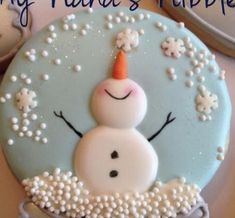 a frosted cookie with a snowman on it's face and the words happy friday written below