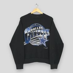 Vintage 90s Distressed Dallas Cowboys NFL Sweatshirt Large Dallas Cowboys Spell Out Sweater Dallas Cowboys American Football Crewneck Size L Good Used Condition. Have several stains, REFER PICTURES. Size (On Tag) : Size L **To make sure if it FITS YOU, refer at the exact measurements. Size Measurement (All measurements were taken lying flat) : Width [armpit to armpit] : 22 inches / 56 cm Length [shoulder to end of garment] : 25 inches / 64 cm THIS IS USED CLOTHING! PLEASE DON`T EXPECTED IT TO BE Distressed Blue Sweatshirt For Streetwear, Throwback Long Sleeve T-shirt For Streetwear, 90s Style Long Sleeve Sweatshirt Fan Merchandise, 90s Graphic Print Sweatshirt For Sports Season, 90s Style Long Sleeve Tops For Game Day, 90s Long Sleeve Top For Game Day, 90s Graphic Print Sweatshirt For Fans, 90s Style Sweatshirt For Game Day, 90s Style Graphic Print Sweatshirt For Fans