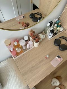 the vanity is cluttered with personal care items and makeup on it's side