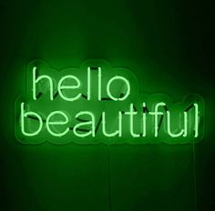 a green neon sign that says hello beautiful