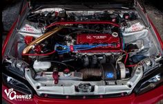 the engine compartment of a red sports car