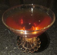 a glass bowl filled with liquid on top of a table