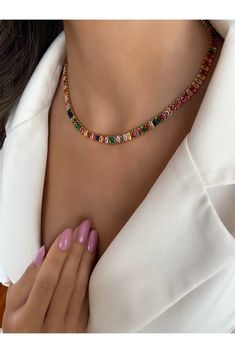 Add a vibrant touch to your jewelry collection with our Rainbow Baguette Tennis Choker Necklace. This exquisite piece features a stunning array of colorful baguette-cut stones set in a sleek gold-plated chain. The combination of the radiant gemstones and the elegant design creates a captivating necklace that is sure to turn heads. Crafted with meticulous attention to detail, this choker necklace offers a perfect balance between sophistication and playfulness. The rainbow-colored stones bring a j Sideways Cross Necklace Silver, Tennis Choker Necklace, Anodized Aluminum Jewelry, Baguette Necklace, Dainty Choker Necklace, Choker Necklace Gold, Gold Chain Choker, Colorful Necklace, Dainty Choker