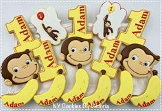 monkey themed cookies for a first birthday with the number one on them and bananas as decorations