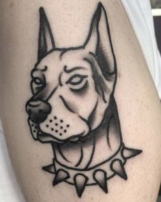 a black and white photo of a dog's head on the left side of a man's arm