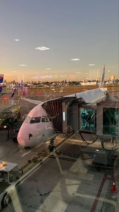 an airplane is parked at the airport terminal