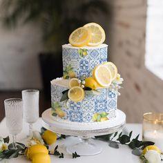 a blue and white cake with lemons on it