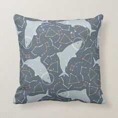 a pillow with dolphins and stars on it