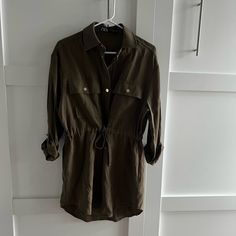 Never Worn, In Perfect Condition! Army Green Color, Cinched Waist, Snaps Down The Front Size Xs Zara Green Casual Shirt Dress, Zara Casual Green Shirt Dress, Casual Green Zara Shirt Dress, Casual Long Sleeve Shirt Dress With Tie Waist, Casual Zara Shirt Dress For Day Out, Casual Mini Dress With Tie Waist, Zara Casual Shirt Dress For Fall, Zara Casual Long Sleeve Mini Dress, Casual Zara Mini Dress With Pockets