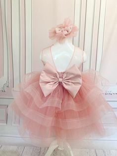 This is a handmade girls dress with layers of tulle for a beautiful look can be customized to any color if you have any questions please feel free to contact me thank you Tulle Tutu Dress With Bow For Dress-up, Sleeveless Tutu Dress With Bow For Pageants, Sleeveless Tutu Dress With Bow For Pageant, Elegant Tulle Tutu Dress With Bow, Princess Tutu Dress With Bow For Dress-up, Princess Style Tutu Dress With Bow For Dress-up, Cute Tulle Tutu Dress With Bow, Cute Wedding Tutu Dress With Bow, Party Princess Dress With Pink Bow