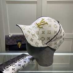 SHOP MORE LUXURY PRODUCTS HERE Description Louis Vuitton Embroidered Logo Baseball Cap White LV Cap Sports-inspired style meets impeccable craftsmanship in the LV. This easy-to-wear piece is defined by an eye-catching visor crafted from durable Monogram coated canvas. The design is finished with an adjustable strap for a custom fit. WhiteMonogram coated canvasAdjustable strap at backDry clean only Includes box, dust bag.This product is of the premium quality. Designer White Visor Baseball Cap, Designer White Snapback Hat, Luxury White Snapback Hat, Designer Baseball Cap With Embroidered Logo, Luxury White Baseball Cap, Designer Embroidered Logo Baseball Cap, Designer White Visor Hat, Luxury Embroidered Logo Snapback Baseball Cap, Luxury Embroidered Snapback Baseball Cap