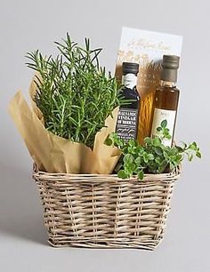 a wicker basket filled with herbs and olive oil