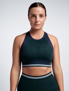 Our original Super-Sculpting Seamless sports bra, once known as Aero.01, AERO DYNAMIC is now made using 100% recycled polyamide and comes in a variety of our signature hues. With a high neckline that’s dedicated to keep your goods secure, its longline silhouette is fully opaque - so you can wear it layered under tanks and tees, or worn solo as a cropped top for warm-wear workouts - while super-slim racerback optimises flexibility, leaving you feeling unrestricted. Bra Size Guide, Seamless Sports Bra, Muscle Tanks, Sports Bra Sizing, Cropped Top, High Neckline, Workout Wear, Fast Fashion, Long A Line