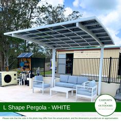 an outdoor living area with white furniture and a pergola - style awning