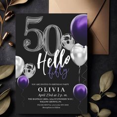 a black and purple 50th birthday party with balloons