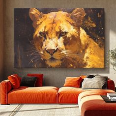 a living room with orange couches and an animal painting on the wall above it