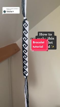 a black and white rope hanging from the ceiling with text overlay that reads how to make this bracelet