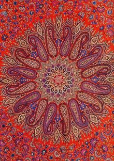 an intricate red and blue pattern on fabric