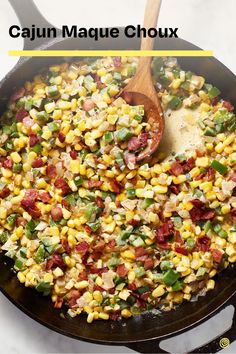 a skillet filled with corn, bacon and green beans on top of a white counter