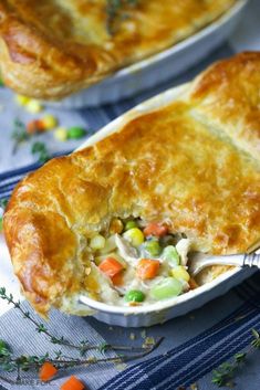 a chicken pot pie with carrots and peas