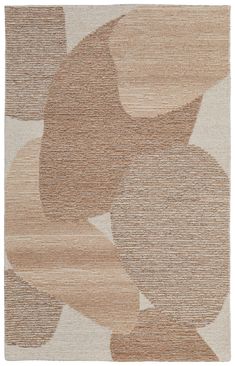 a beige and brown rug with circles on it