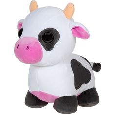 a small stuffed cow sitting on top of a white floor