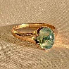 Antique 9k yellow gold ring featuring a moss agate cabochon cut gemstone. Great antique condition Size: 6 resizable* Weight: 2.3 grams Band: 8.2 mm (front), 2.0 mm (back) Moss Agate: 7.8 mm cabochon cut Luxury Agate Cabochon Rings, Antique Agate Ring, Green Agate Ring, Moss Agate Ring, Agate Cabochon, Cabochon Ring, Green Agate, Agate Ring, Yellow Gold Ring