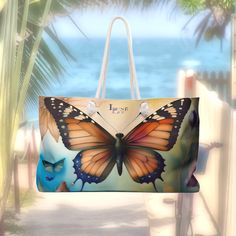 "A Lune Lou original design, our oversized Beautiful Butterfly inspired Beach/Tote Bag is perfect for a day at the beach or a weekend getaway.  The wide-mouthed, durable 24\" x 13\" bag holds a generous amount of personal items and is easily held by its thick rope handles.  Made to order from 100% Spun Polyester Canvas, with a cream sheeting interior lining. Lune Lou products are custom made when ordered in the USA!  We do not have them mass produced in a factory in China!" Beach Tote Weekender Bag With Large Capacity, Beach Weekender Bag With Large Capacity, Summer Beach Weekender Bag In Rectangular Shape, Large Capacity Tote Weekender Bag For Beach, Summer Rectangular Weekender Bag For Beach, Rectangular Summer Weekender Bag For Beach, Beachwear Tote Beach Bag For Travel, Travel-ready Beachwear Tote Beach Bag, Summer Weekender Bag With Large Capacity For Beach