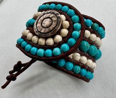 Beaded Cuff Bracelet in Turquoise & White, 3mm Leather Cord and Metal Button Closure. Cowgirl Boho Gift for Her, Handmade Statement Bracelet - Etsy Handmade Turquoise Leather Bracelet Spiritual, Handmade Adjustable White Leather Bracelet, White Handmade Adjustable Leather Bracelet, Handmade White Leather Adjustable Bracelet, Adjustable Handmade White Leather Bracelet, Handmade Turquoise Wrap Bracelet, Handmade Turquoise Leather Bracelet, Bohemian Style, Handmade Turquoise Leather Bracelet In Bohemian Style, Handmade Bohemian Turquoise Leather Bracelet