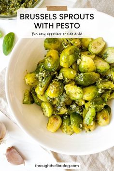 brussel sprouts with pesto in a white bowl on a table