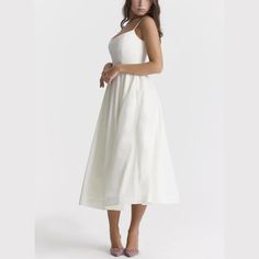 Step into elegance with our Spaghetti Strap A-Line fit and flare Midi Dress. This dress promises a graceful silhouette with its fitted bodice and flowing skirt. The spaghetti straps offer a delicate touch, perfect for both casual outings and special occasions. Made from lightweight, breathable fabric, it's designed for comfort without sacrificing style. Pair it with sandals for a relaxed look or heels to make a statement. Versatile and chic, this midi dress is a wardrobe must-have. Color: White, Brunch Dress With Fitted Bodice And Spaghetti Straps, Fitted Bodice Dress With Spaghetti Straps For Brunch, Spaghetti Strap Dress With Fitted Bodice For Brunch, Brunch Dress With Spaghetti Straps And Fitted Bodice, Summer A-line Suspender Dress With Fitted Bodice, Fitted Bodice Spaghetti Strap Sundress For Garden Party, Fitted Bodice Sundress With Spaghetti Straps For Garden Party, Fitted Bodice Sundress With Spaghetti Straps, Elegant Midi Dress With Sweetheart Neckline And Delicate Straps