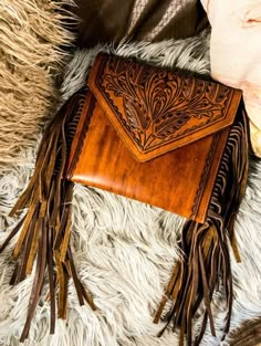 Leather tooled bag with fringe detail. H 8 W 11 Vintage Leather Bags With Fringe, Leather Fringe Clutch Bag, Vintage Rectangular Fringe Bag, Diy Leather Purse Pattern, Western Shopping, Clothes Layering, Western Bags Purses, Leather Purse Pattern, Antique Turquoise Jewelry