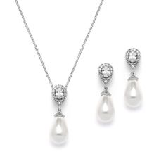 PRICES MAY VARY. LUXURY STYLE: Mariell's Wedding or Bridesmaid Necklace and Earrings Jewelry Set Features Oval-Cut Gems in a Pave Frame and Soft Ivory Teardrop Shaped Pearl Dangles PERFECT SIZE: Pierced Earrings Measures 1 1/8" High with 10mm Pearl Drops, Pierced Earring Design with Comfort Disc Backs, Neckcalce Adjustable 16" - 19", Striking 10m Shell Pearl QUALITY DESIGN: Vintage Bridal or Bridesmaid Cubic Zirconia Necklace and Earrings Set with Soft Cream Pearls, Perfect for Bridal Parties an Necklace Guide For Wedding Dresses, Bridesmaid Dresses And Jewelry, Wedding Day Necklace Bride, Luxury Adjustable Drop Necklace For Formal Occasions, Pearl Wedding Jewelry Sets, Elegant Pearl Jewelry, Pearl Wedding Jewelry, Bridal Pearl Necklace, Wedding Jewelry Set