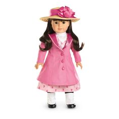 a doll wearing a pink coat and hat