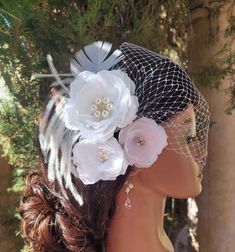 "Here is a beautiful set of set 9f three white flower clips and bandeau birdcage veil. The flowers attached to alligator clips. Ostrich feathers attached to the flower clip. The center of the biggest flower decorated with rhinestone brooch and the smaller flowers decorated with natural  freshwater pearls and rhinestone crystals.  The veil and the flower fascinators are separate pieces. The veiling is white color.  The bandeau veil is attached to the bobby pins. The veiling part is very versatile White Adjustable Hair Accessories For Ceremony, White Adjustable Hair Accessories For Ceremonies, White Flower-shaped Hair Accessories With Handmade Flowers, White Handmade Flowers Headband, Elegant White Flower Headband, Elegant Wedding Hair Accessories With Flower Decoration, Elegant Flower Wedding Hair Accessories, Flower Shaped White Headband For Weddings, Wedding Fascinator With Flower Decoration