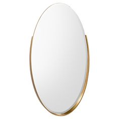 an oval mirror with gold trim around the edges and a white back dropper on top