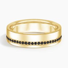 a yellow gold wedding band with black diamonds