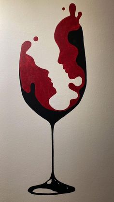 a painting of a woman's face in a glass of red wine on a white wall