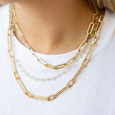 A modern-day classic, this chunky matte gold necklace is undeniably chic. Crafted to emanate strength and femininity, this piece never fails to elevate any look, with its chunky rectangle chain links and lobster clasp. Truly perfect all by itself or layered with other lengths and textures to create your statement look. Length: 21” The chain is 14K gold plated over brass with a matte finish The clasp is easy to open, lobster clasp All metals are Lead, Nickel, and Cadmium free Designed and handcra Elegant Layered Necklace With Chunky Chain Links, Elegant Necklace With Chunky Rectangular Chain, Chic Necklaces With Cable Chain And Rectangular Links, Gold Rectangular Chain Necklace, Chic Style, Chic Jewelry With Chunky Chain And Rectangular Links, Chic Gold Chain Necklace With Rectangular Links, Chic Chunky Chain Jewelry With Rectangular Links, Chic Gold Rectangular Chain Necklace, Chic Rectangular Gold Chain Necklace