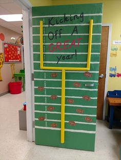 a classroom door decorated with a football field and the words kicking off a great year